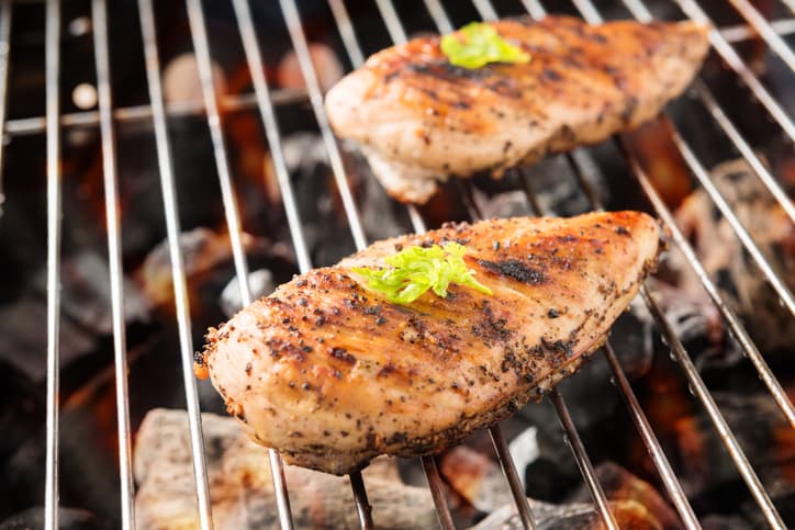 Grilled chicken on grill rack