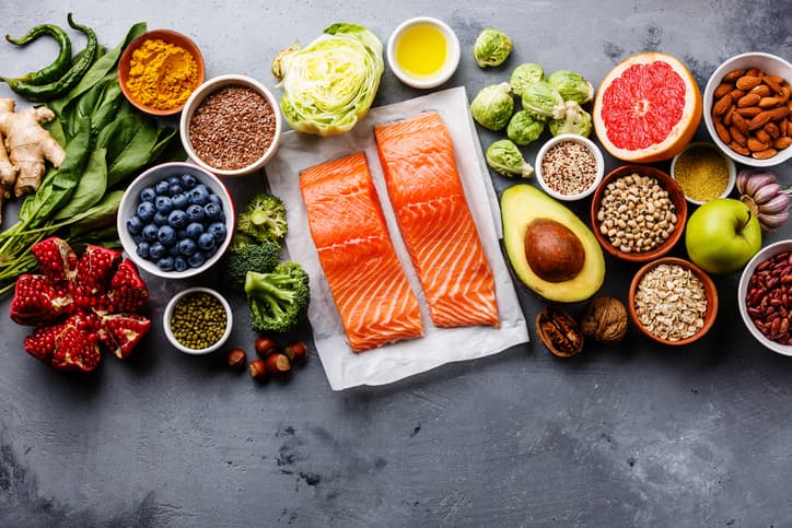 Spread of fruits and vegetables and salmon filets