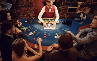 A casino worker dealing at a table who has to deal with higher cancer rates from secondhand smoke.