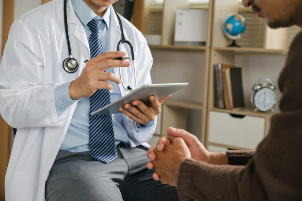 A doctor completing a preventative screening to check for firefighter cancer rates.