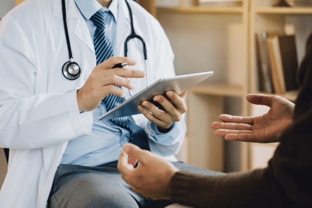 Doctor Consulting With Patient