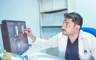 Doctor looking at results of scan on screen