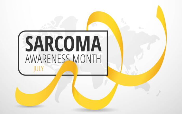 A Yellow Ribbon With The Text: Sarcoma Awareness Month - July.