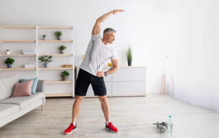 A Man Exercising In His Living Room.