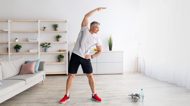 A Man Exercising In His Living Room. 