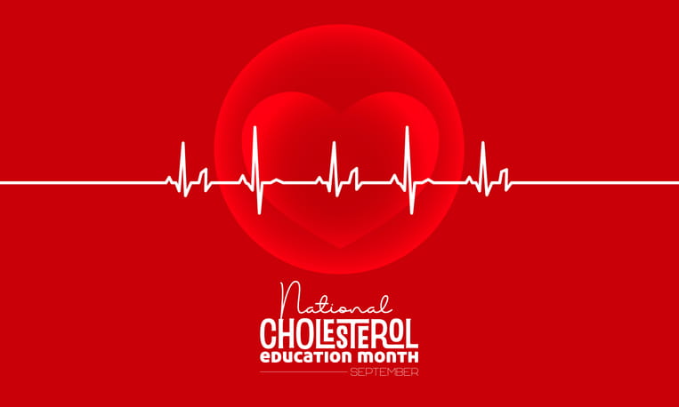 A Graphic For National Cholesterol Education Month In September, Featuring A White Ekg Heartbeat Line Passing Over A Large Heart Icon On A Red Background.