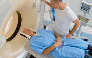 A Man About To Enter A Ct Scan For Cancer Screening.
