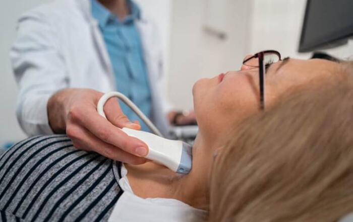 Pdc Home 2 A Woman Is Getting A Thyroid Ultrasound.