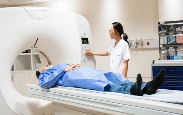 Pdc Home 3 A Nurse Assists A Patient Who Is Getting A Ct Scan.